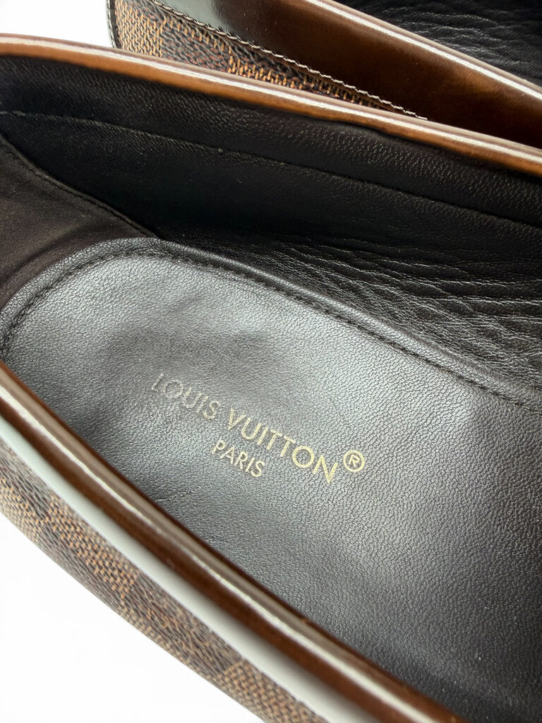 Detailed view of Louis Vuitton men's loafer interior with premium black leather footbed and embossed brand logo. From designer consignment boutique, Dee Black, in Perth, Western Australia.