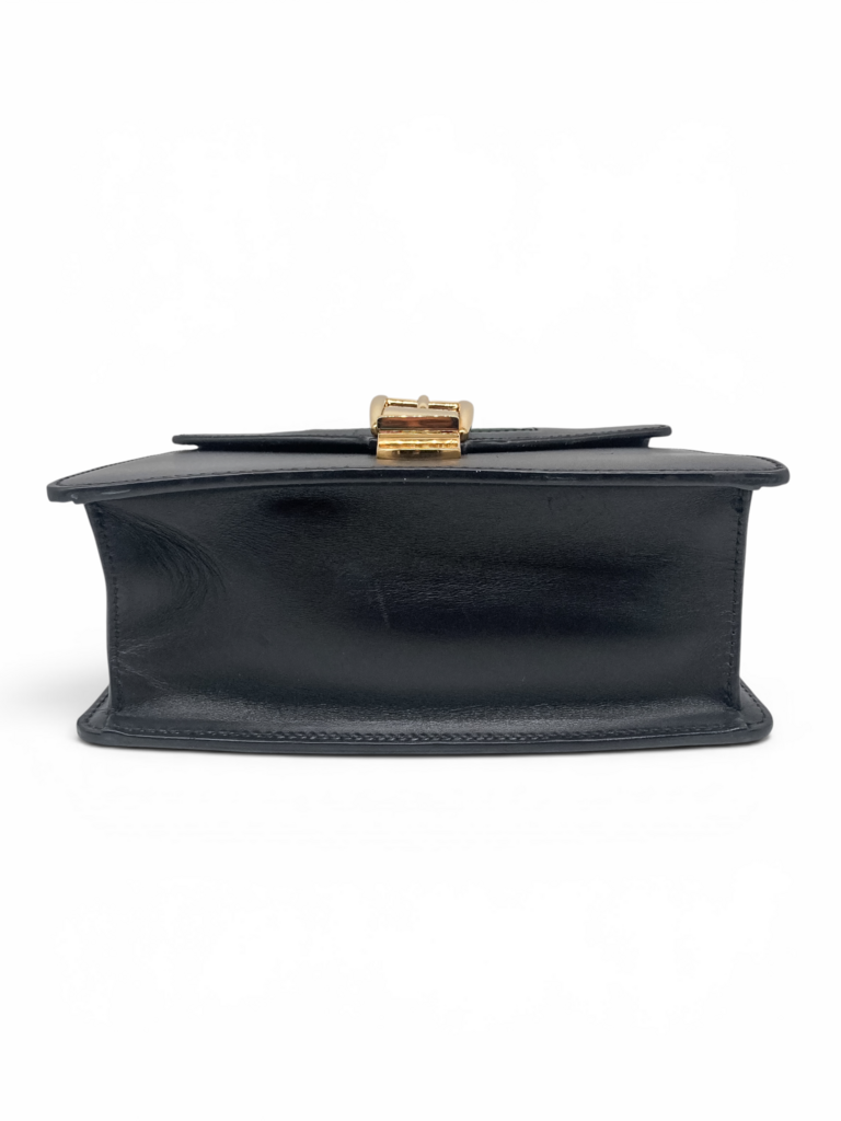 Gucci Sylvie black leather top handle bag viewed from the base, highlighting its structured construction and luxury craftsmanship. From designer consignment boutique Dee Black, in Perth, Western Australia.