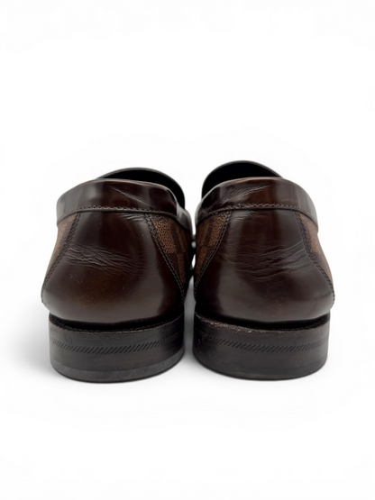 Louis Vuitton men's Damier Ebene loafers shown from the back, featuring polished brown leather detailing and durable rubber soles. From designer consignment boutique, Dee Black, in Perth, Western Australia.