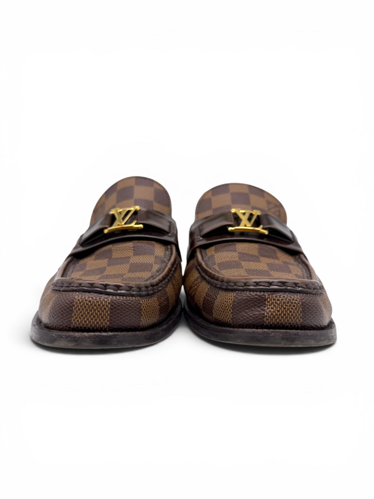 Louis Vuitton men's Damier Ebene loafers with gold LV logo detailing, shown from the front.
From Designer Consignment Boutique, Dee Black, in Perth Western Australia.