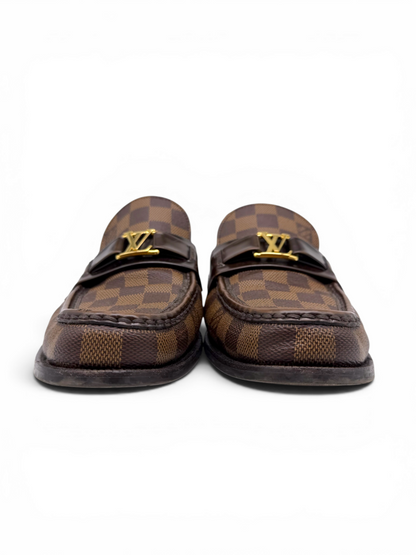 Louis Vuitton men's Damier Ebene loafers with gold LV logo detailing, shown from the front.
From Designer Consignment Boutique, Dee Black, in Perth Western Australia.